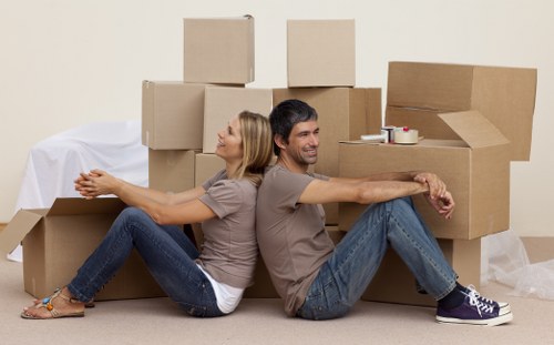 Packed boxes and furniture prepared for a flat removal in Uxbridge
