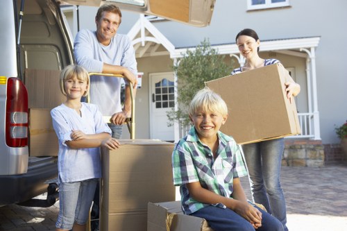 Professional movers handling packed boxes carefully