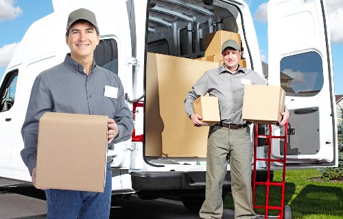 Manager checking complaint records for a moving service
