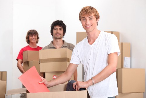 Local movers unloading office items at a business premises in Uxbridge