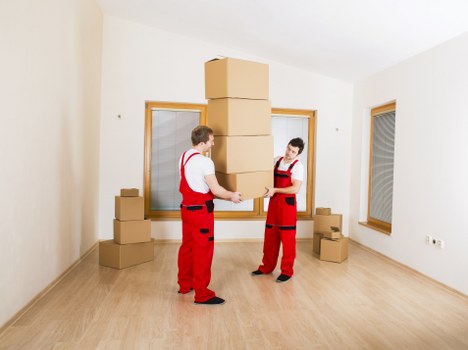 Office furniture and boxed files arranged for delivery to a new workplace