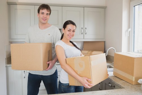 Local movers preparing fragile items for transport in Uxbridge